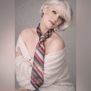 💯 % silk tie I don’t know the brand, but it’s diagonal stripes, purple, lime